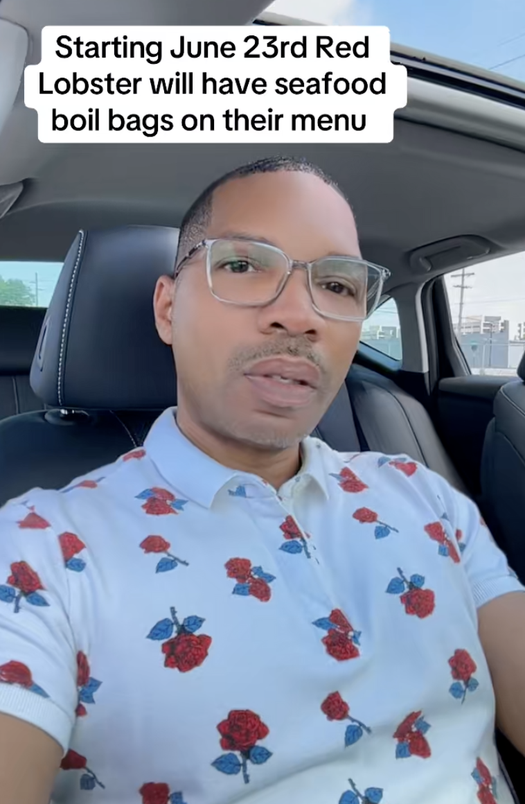 man talking in his car